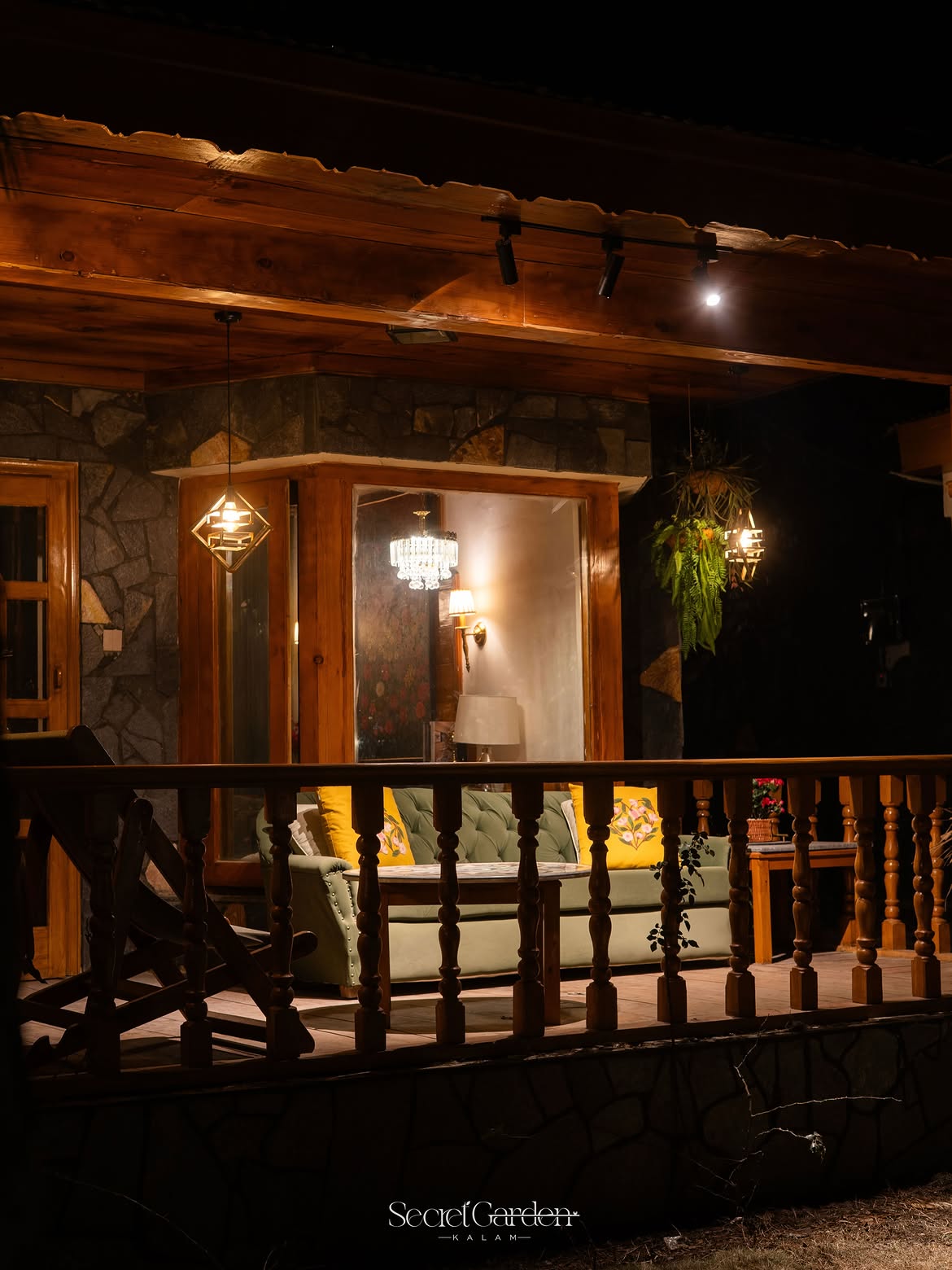 Secret Garden veranda sofa illuminated at night with warm ambiance