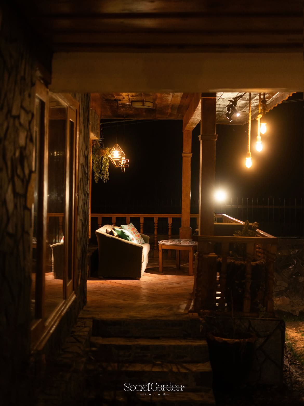 Veranda passage lit with warm lights at Secret Garden Kalam