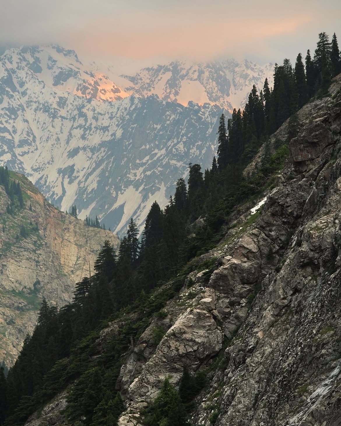 Snow covered alpine mountain ridge towering over Kalam valley