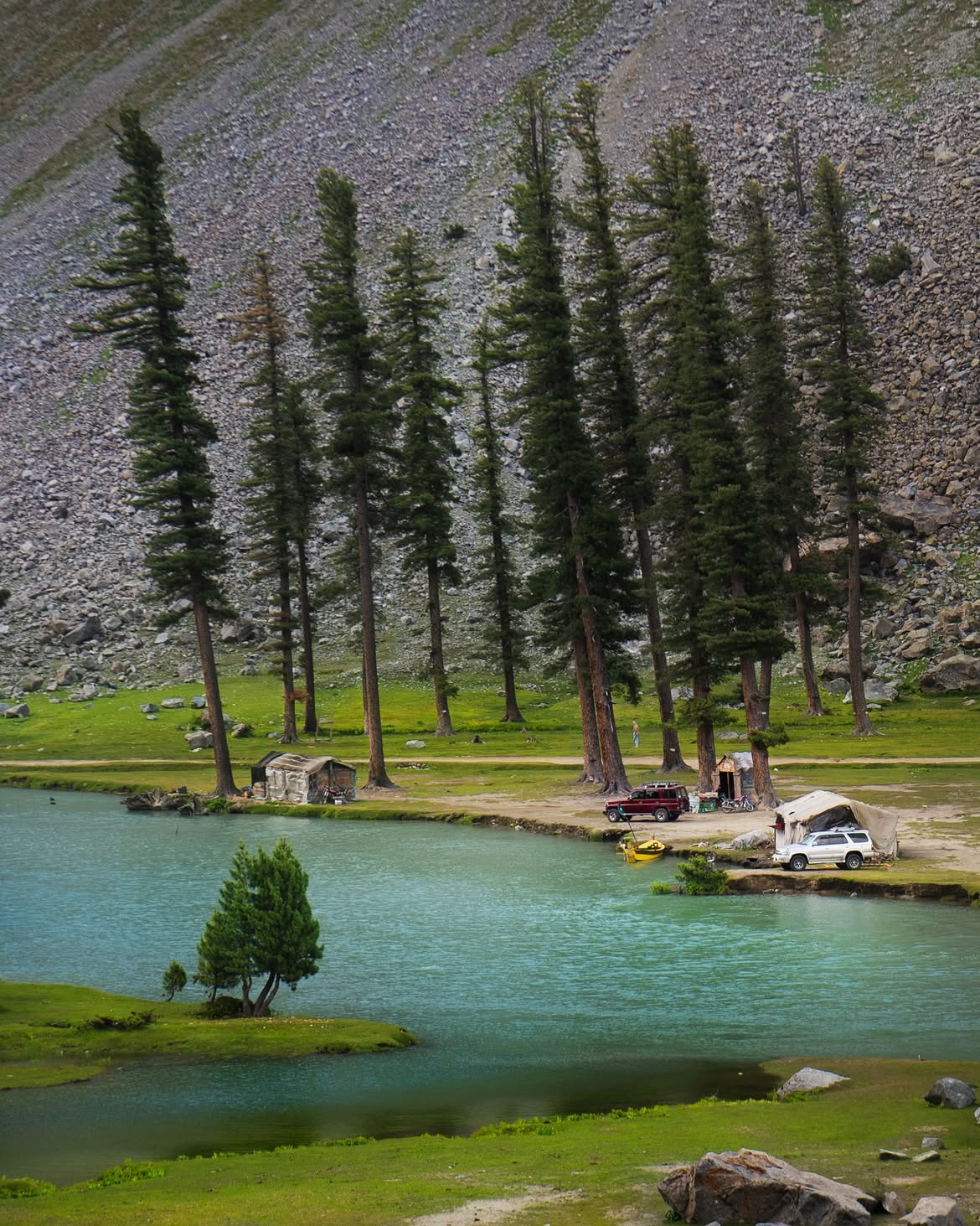 Kalam alpine lake bordered by tall pines