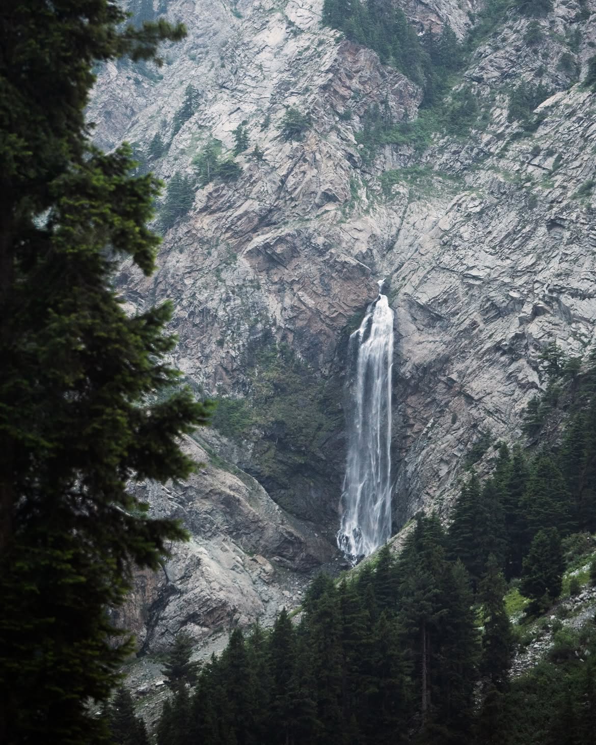 Waterfall tumbling down rocky cliff in Kalam
