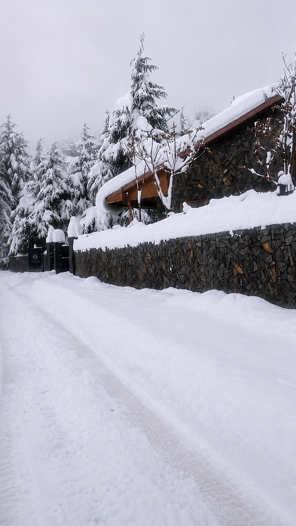 Snow covered winter entrance road to retreat